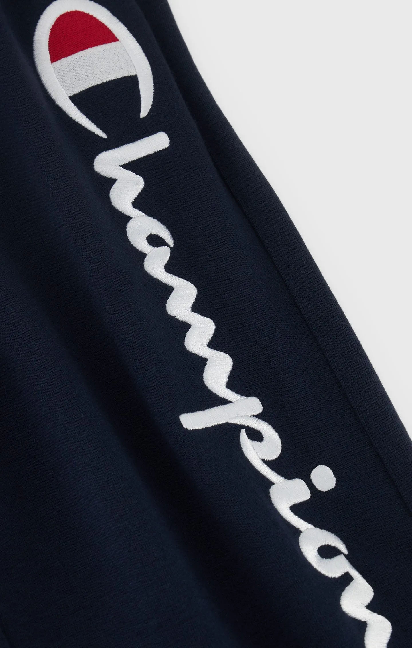 Joggers con pernera bordada
